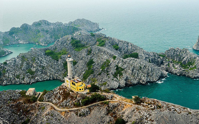 Long Chau lighthouse stands tall in the vast sky and sea