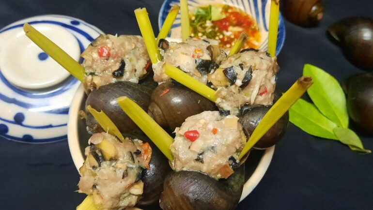 Stuffed apple snail steamed with lemongrass and chili.