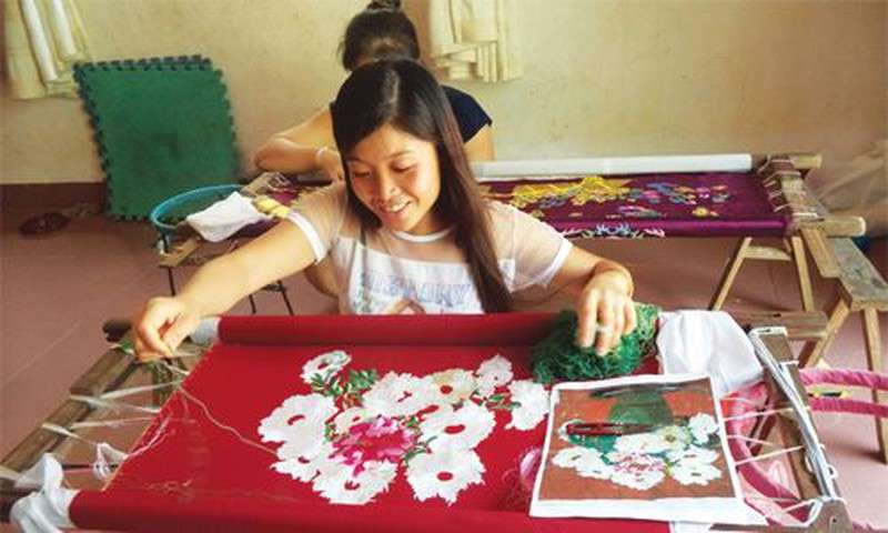 Thanh Ha lace embroidery village you can learn about unique culture and craft.